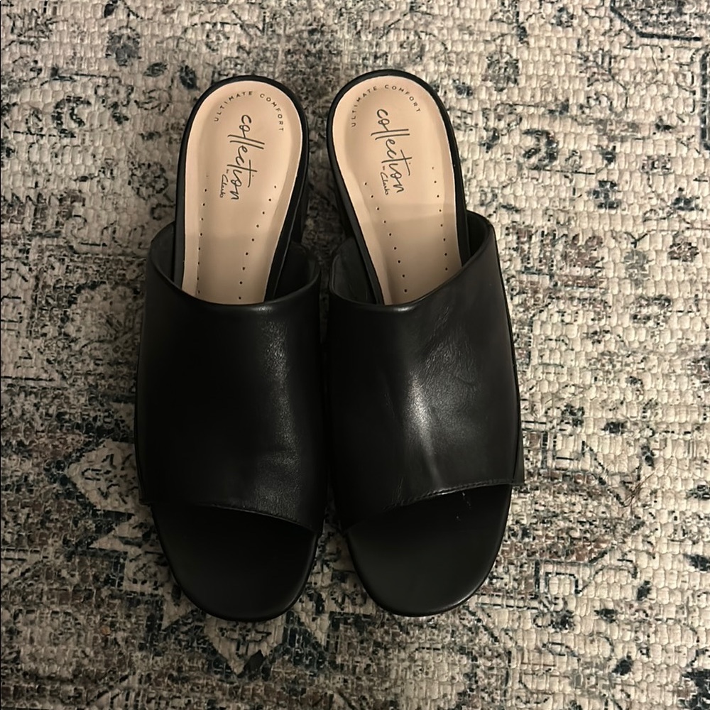 Clarks Black Leather Mules with Minimalist Design